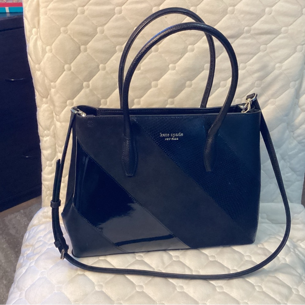Kate Spade black patent leather and suede crossbody tote with silver hardware.